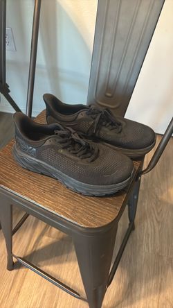 All black Hokas