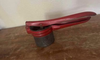 Antique potato press
