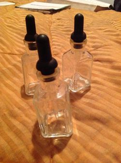 3 vintage glass bottles with glass droppers