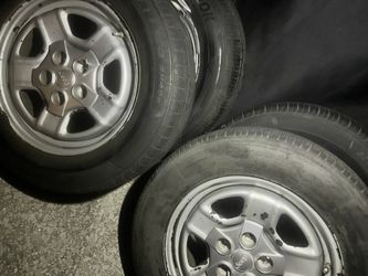 4 stock jeep tires