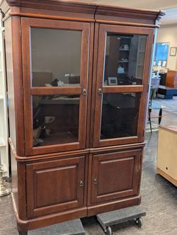 Two Corner Cabinets With Lighting