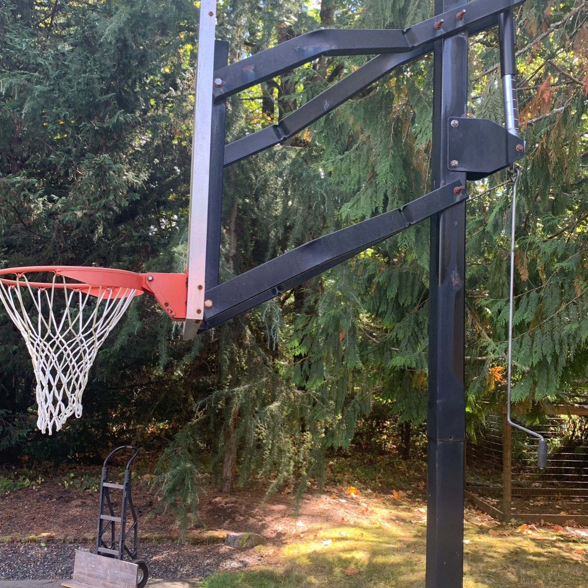 2 In-Ground Adjustable Basketball Hoops.  Will sell individually.