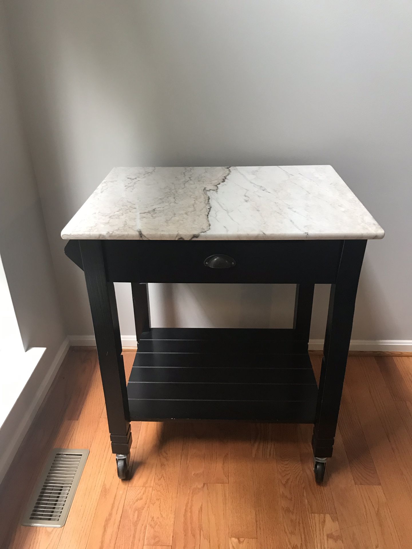 Small kitchen island with marble-granite top