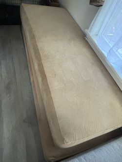 Free Corner couch and Bench style seat at turns into a place to sleep.