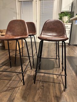 4 Brown Bar/Counter Stools pick up ASAP in ATL.  Seat height 2 ft from floor.
