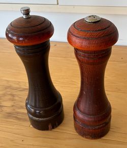 Wood pepper grinder and salt shaker, 8”tall.