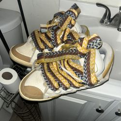 Lanvin used steel lil rip on the side good condition size 10.5 fit like 11 great deal 