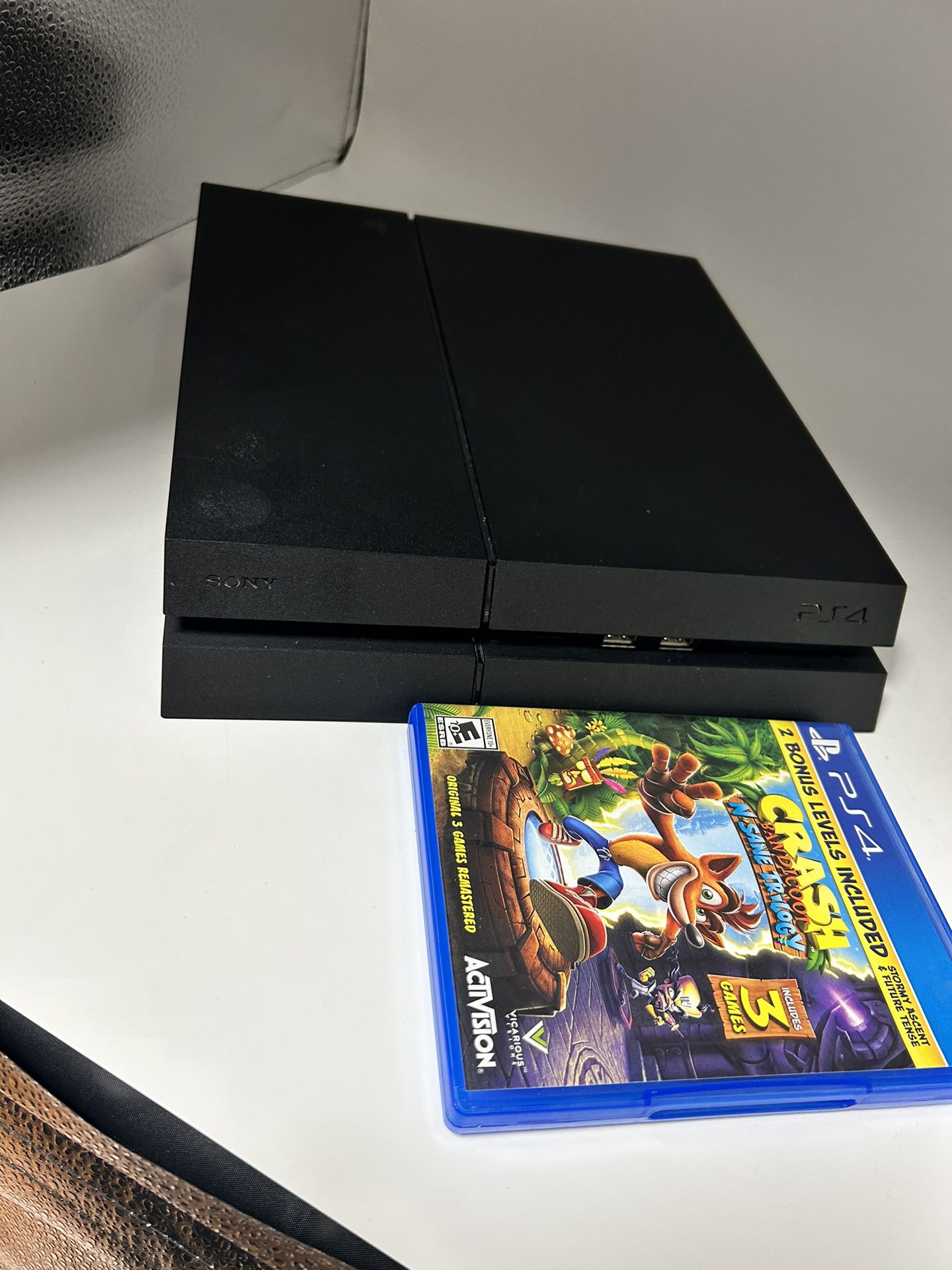 A PS4 Black Slim Console Including Game And Cords! 