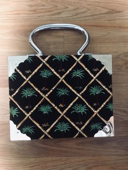 Unique purse made from wooden cigar box .