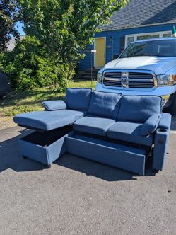 Navy blue L shaped couch with storage