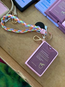 Bath and body key chain with sanitizer
