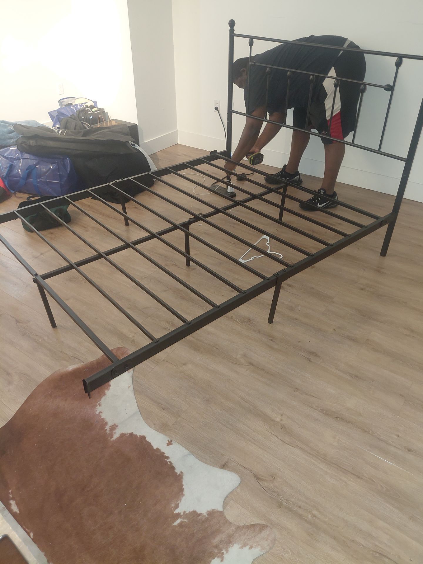 Queen bed with mattress bathroom toilet rack and wardrobe hanger and chair
