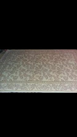 Oriental rug brown/ creme color