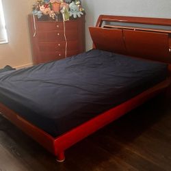 set full-size brown wood bed frame with 2 storage cabinets on headboard and include 5 drawers wood cabinet