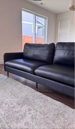 Black Leather Sofa with Metal Legs .