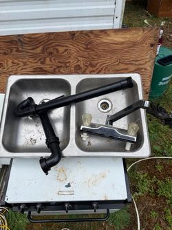 RV sink with faucet and drain pipes