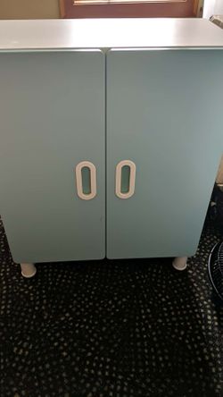 White Cupboard With Feet, A Shelf, Colored Cupboard Doors.