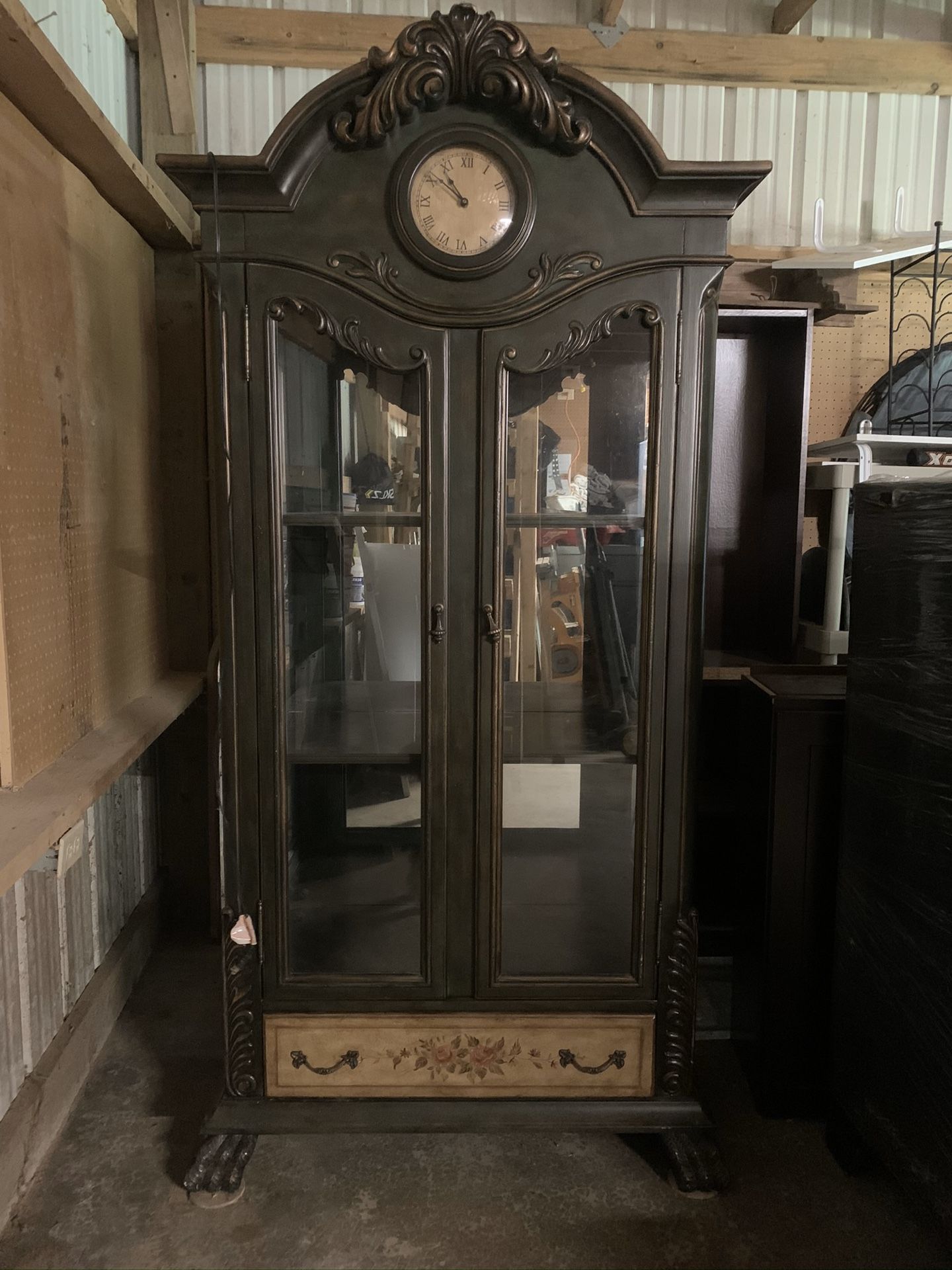 Antique display cabinet with clock