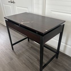 Brown wooden desk with metal framing