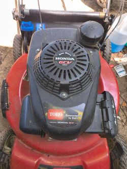 2 working Toro lawn mowers.