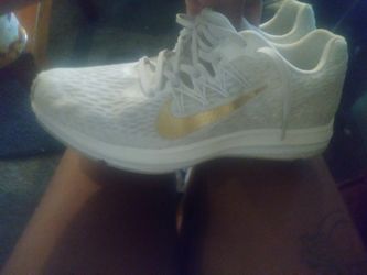 White and gold nikes