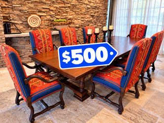 12’ wood dining table with 8 arm chairs