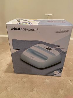 Cricut easy press 3 with Cricut pressing mat and open pack of 10 iron-on transfer sheets