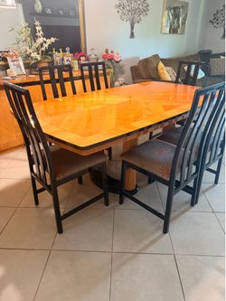 Beautiful wooden dining table with six chairs