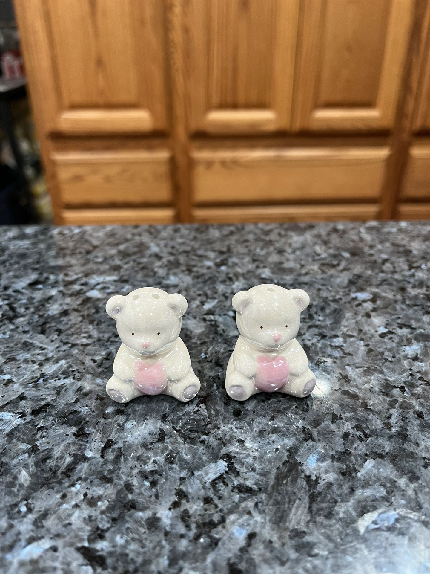 Ceramic Vintage Cute Bear holding a Heart  Pair of Salt and Pepper Shakers.  Size approximately 1 1/2 inches tall.  Preowned excellent condition