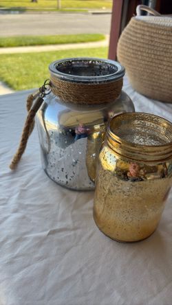 2 glass decorative jars.