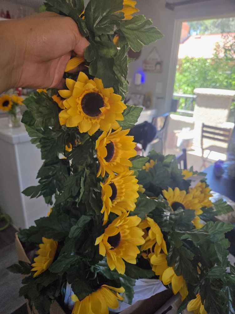 4 - Artificial Sunflower Garland 66 in long. $15 for all 4 or $5 for 1.