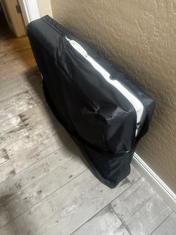 Portable white massage table