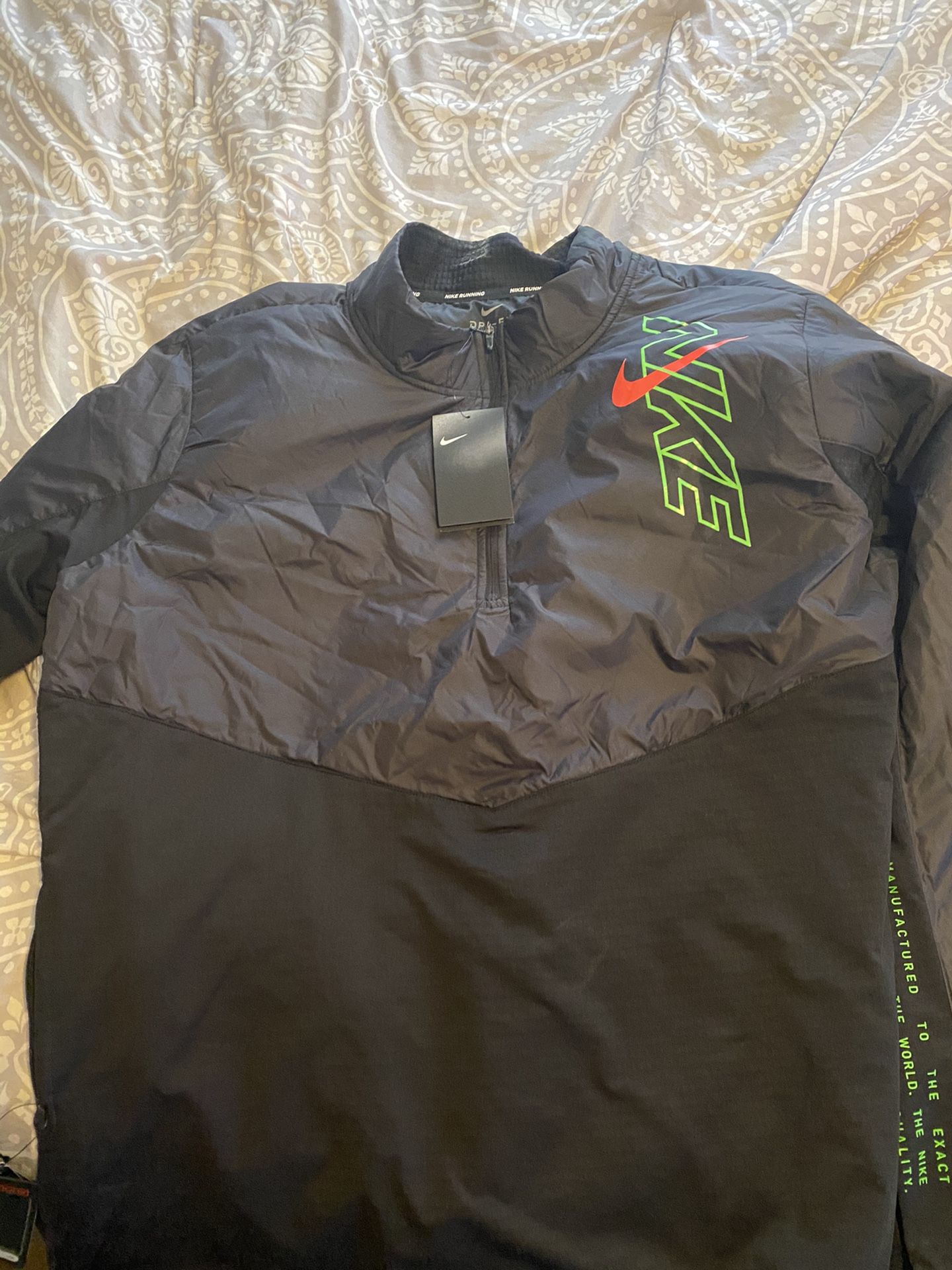 Nike running jacket brand new.