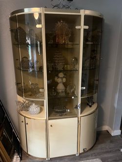 3-piece white curved-glass lighted curio cabinet or display wall unit.