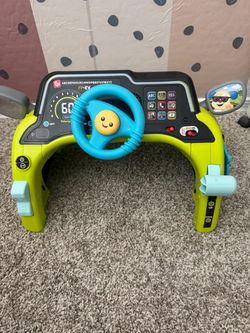 Fisher Price sit and steer driver car