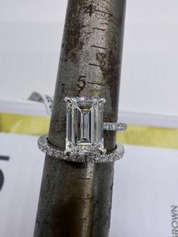 3.03 carat F VS1 emerald cut lab diamond on a pave band and a half engagement ring