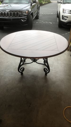 Photo Wood round table with custom glass topper and rod-Iron base