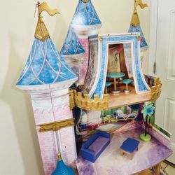 Disney Princess Royal Celebration wooden doll house made by KidKraft. It stands over five feet tall. (4) four Frozen Disney Princess Dolls