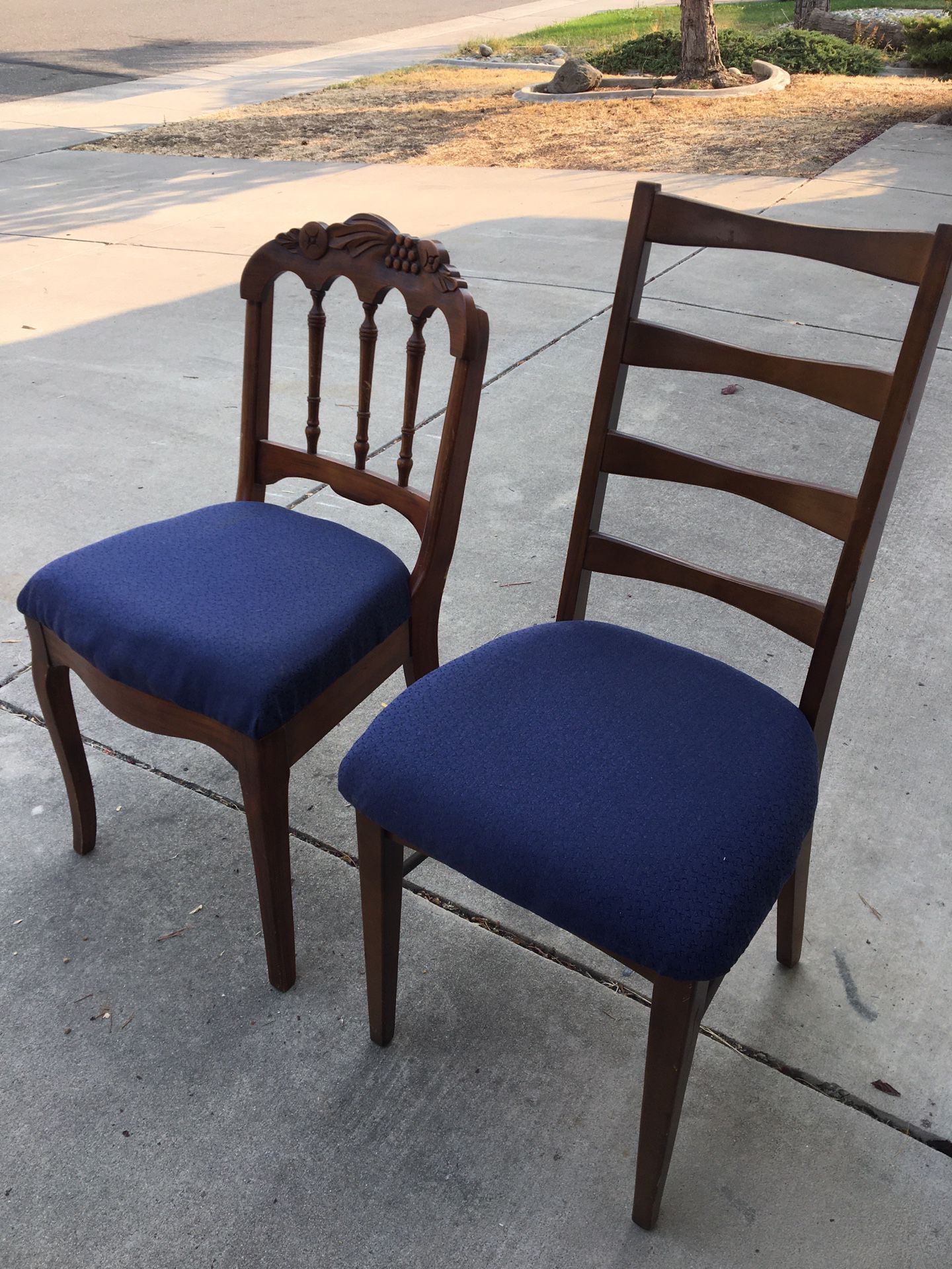 Two wood chairs with padded seats