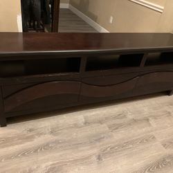 TV Shelf / TV Stand With Child Edge Protector Furniture Piece 80 inches Long /16 inches In Depth /27 inches Tall. Great Piece For Your Abode.
