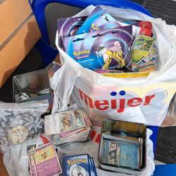 Pokémon Collectable Tin Full Of Pokémon Cards And Coin.
