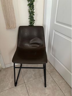 Brown faux leather chair