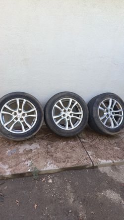 Three Camaro rims