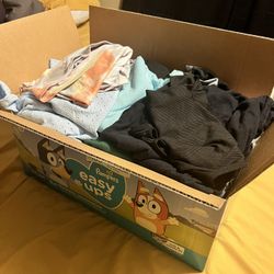 box of plus sized womens clothes. 