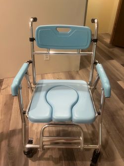 Shower chair with locking wheels/ bedside commode