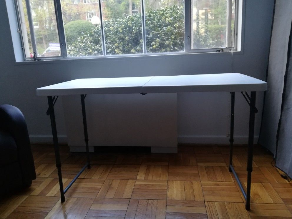 Foldable white table 24in x 48 in