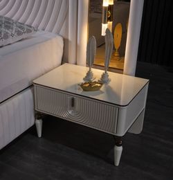 Elegant Modern Nightstand with Fluted Drawer & Decorative Legs