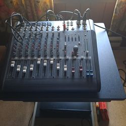 Super Loud And Very Cool PA System With Mackie DFX Mixing Board And 2 Berringer 15 Inch 2 Way Powered PA Speakers With Stands Includes Wires And Mics.