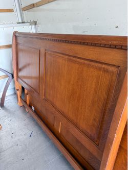Queen sized solid wood sleigh bed