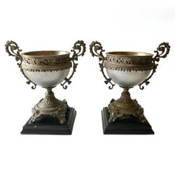 Castilian Imports Pair of Silver Metal Urns on Black Bases